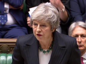 A video grab from footage broadcast by the U.K. Parliament's Parliamentary Recording Unit shows Britain's Prime Minister Theresa May giving a statement to the House of Commons in London on November 15, 2018.