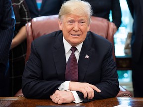 Donald Trump speaks after signing the Cybersecurity and Infrastructure Security Agency Act,  in the Oval Office of the White House in Washington, DC, November 16, 2018.