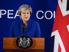 Britain's Prime Minister Theresa May gives a press conference after a special meeting of the European Council to endorse the draft Brexit withdrawal agreement and to approve the draft political declaration on future EU-U.K. relations on November 25, 2018 in Brussels.