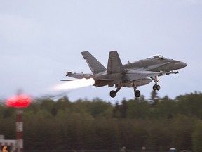 An RCAF CF-18 takes off from CFB Bagotville, Que. on June 7, 2018.