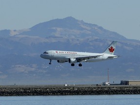 In this Oct. 24, 2017 file photo, an Air Canada plane prepares to land on a runway at San Francisco International Airport in San Francisco. Air Canada ranks among some of the best premium economy flights in the skies right now.