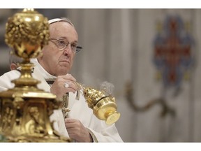 Pope Francis incenses the altar as he celebrates a mass in St. Peter basilica at the Vatican, Sunday, Nov. 18, 2018. Pope Francis is offering several hundred poor people, homeless, migrants, unemployed a lunch on Sunday as he celebrates the World Day of the Poor with a concrete gesture of charity in the spirit of his namesake, St. Francis of Assisi.