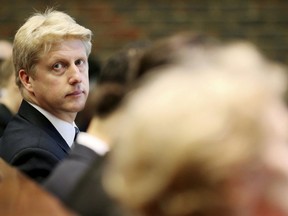 FILE  - In this March 3, 2016 file photo, Universities Minister Jo Johnson is photographed prior to giving a speech on science, universities and the EU at the Babbage Lecture Theatre, University of Cambridge in Cambridge. England.  Johnson, the younger brother of Boris Johnson, stepped down as a transport minister Friday, Nov. 9, 2018 and called for a second Brexit referendum. He says Britain's Prime Minister Theresa May's Brexit plan would damage Britain's national interest.