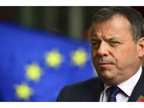 Leave campaigner and businessman Arron Banks, centre,  speaks to the media outside BBC Broadcasting House in London, after appearing on the Andrew Marr show, in London, Sunday, Nov. 4, 2018. Britain's National Crime Agency is investigating a main financial backer of the campaign to get Britain out of the European Union over suspected illegal funding during the country's EU membership referendum, authorities said Thursday.