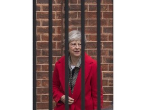 Britain's Prime Minister Theresa May leaves Downing Street in London, Friday, Nov. 16, 2018. May appealed directly to voters to back her Brexit plan Friday as she braced for a potential leadership challenge from rivals within her party.