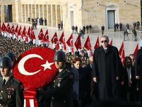 Turkey's President Recep Tayyip Erdogan, front right, attends a wreath-laying ceremony at the mausoleum of the nation's founding father Mustafa Kemal Ataturk, during a ceremony to mark the 80th anniversary of his death, in Ankara, Turkey, Saturday, Nov. 10, 2018.