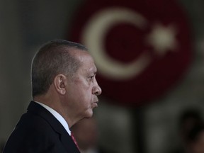 Turkey's President Recep Tayyip Erdogan attends a wreath-laying ceremony at the mausoleum of the nation's founding father Mustafa Kemal Ataturk, during a ceremony to mark the 80th anniversary of his death, in Ankara, Turkey, Saturday, Nov. 10, 2018.