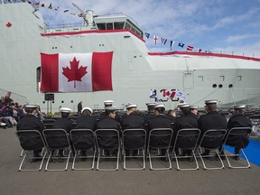 Royal Canadian Sea Cadets wait for the start of the naming ceremony for Canada's lead Arctic and Offshore Patrol Ship, the future HMCS Harry DeWolf, at Halifax Shipyard in Halifax on Friday, Oct. 5, 2018.