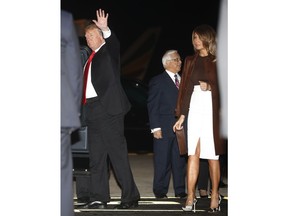 President Donald Trump and first lady Melania Trump walk from Air Force One, Thursday, Nov. 29, 2018, as they arrive in Buenos Aires, Argentina. Trump traveled to Argentina to attend the G20 summit.