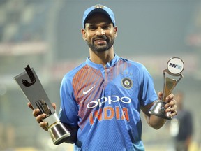 India's Shikhar Dhawan poses with the Man of the Match trophy after his team's win in the third and last Twenty20 international cricket match against West Indies in Chennai, India, Sunday, Nov. 11, 2018. India won the series 3-0.