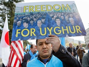 Uighurs demonstrate outside the European headquarters of the United Nations, in Geneva, Switzerland, during a review of China by the UN Human Rights Council, on Nov. 6, 2018.