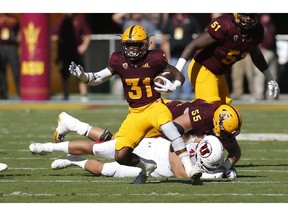 Arizona State running back Isaiah Floyd (31) runs the ball for a first down against Utah in the first half during an NCAA college football game, Saturday, Nov. 3, 2018, in Tempe, Ariz.