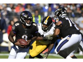 Baltimore Ravens quarterback Lamar Jackson (8) rushes the ball in the first half of an NFL football game against the Pittsburgh Steelers, Sunday, Nov. 4, 2018, in Baltimore.