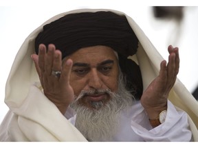 FILE - In this Nov. 24, 2017 file photo, the head of the Pakistani Tehreek-e-Labbaik radical religious party, Khadim Hussain Rizvi prays during a sit-in protest in Islamabad, Pakistan. The party of a radical Islamic cleric who disrupted daily life with rallies across Pakistan following the acquittal of a Christian woman in a blasphemy case says he has been arrested Friday, Nov. 23, 2018 by police in the city of Lahore.