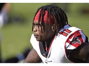 FILE - In this Sunday, Nov. 11, 2018, file photo, Atlanta Falcons wide receiver Julio Jones watches warm ups before an NFL football game against the Cleveland Browns in Cleveland. Authorities say four relatives of Jones have been wounded in a shooting at an Alabama trailer park.