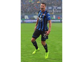 Atalanta's Hans Hateboer celebrates after scoring his side's opening goal during the Serie A soccer match between Atalanta and Inter Milan, in Bergamo, Italy, Sunday, Nov. 11, 2018.