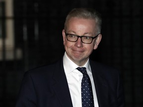 Environment Secretary Michael Gove leaves  10 Downing Street in London.