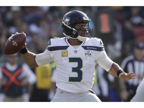 Seattle Seahawks quarterback Russell Wilson passes against the Los Angeles Rams during the first half in an NFL football game Sunday, Nov. 11, 2018, in Los Angeles.