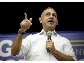 FILE - In this Monday, Nov. 5, 2018 file photo, Gil Cisneros, a Democratic candidate who is running for a U.S. House seat in California's 39th District, speaks during a campaign stop in Buena Park, Calif. Cisneros captured a Republican-held U.S. House seat in Southern California on Saturday, Nov. 17, 2018, capping a Democratic rout in which the party picked up six congressional seats in the state. Cisneros had been in a tight battle with Republican Young Kim for the seat held by retiring Republican Rep. Ed Royce.