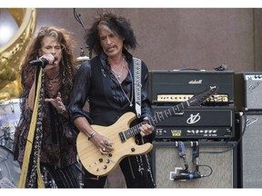 FILE - In this Aug. 15, 2018 file photo, Steven Tyler, left, and Joe Perry of Aerosmith perform on NBC's "Today" show at Rockefeller Center in New York. Perry has cancelled his fall tour to take time off after recently being hospitalized with breathing problems. The Aerosmith guitarist's publicist said in a statement Tuesday, Nov. 20, 2018, the 68-year-old will take the rest of the year off. He had expected to return to the road starting Nov. 30 through Dec. 16.