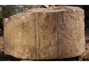 This undated photo released by the Egyptian Ministry of Antiquities, shows part of a stone slab tht was discovered at a dig in eastern Cairo's Matariya neighborhood, Egypt. The Antiquities Ministry said on Tuesday, Nov. 6, 2018, that archeologists working at the dig have found several fragments of stone slabs with inscriptions dating back up to 4,000 years. Some of the fragments date back to the 12th and the 20th Dynasties and the Third Intermediate Period while others are more recent. (Egyptian Ministry of Antiquities via AP)