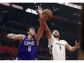 Los Angeles Clippers' Danilo Gallinari (8) blocks a shot from Memphis Grizzlies' Kyle Anderson (1) during the first half of an NBA basketball game Friday, Nov. 23, 2018, in Los Angeles.