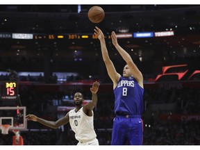 Los Angeles Clippers' Danilo Gallinari (8) shoots past Memphis Grizzlies' JaMychal Green (0) during the second half of an NBA basketball game Friday, Nov. 23, 2018, in Los Angeles.