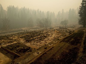 Leveled residences line a mobile home park on Edgewood Lane after the Camp Fire burned through Paradise, Calif., on Saturday, Nov. 10, 2018. Not much is left in Paradise after a ferocious wildfire roared through the Northern California town as residents fled and entire neighborhoods are leveled.