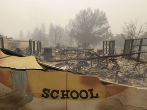 The burned remains of the Paradise Elementary school is seen Friday, Nov. 9, 2018, in Paradise, Calif. Blocks and blocks of homes and businesses in the Northern California town have been destroyed by a wildfire. Parts of the town of Paradise were still on fire on Friday.