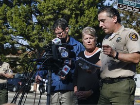 Standing at the microphones, from left to right, Paul Delacourt, assistant director for the FBI Los Angeles, and U.S. Rep. Julia Brownley look on as Ventura County Sheriff's Capt. Garo Kuredjian speaks to the media, Thursday, Nov. 8, 2018, in Thousand Oaks, Calif. Multiple people were fatally shot late Wednesday by the gunman who opened fire at the Borderline Bar and Grill, which was holding a weekly country music dance night for college students.