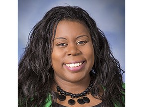 In this September 2017 photo provided by Monte Gerlach Photography Dr. Tamara O'Neal poses for a photo. O'Neal, an emergency room physician at Mercy Hospital in Chicago, was shot and killed by a gunman outside the hospital Monday, Nov. 19, 2018.