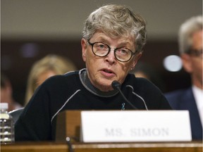 FILE - In this June 5, 2018 file photo, former Michigan State President Lou Anna Simon testifies before a Senate subcommittee in Washington. Simon has been charged with lying to police conducting an investigation of Larry Nassar's sexual abuse. Simon, who stepped down earlier this year over the scandal, was charged Tuesday, Nov. 20, 2018, with two felonies and two misdemeanors.