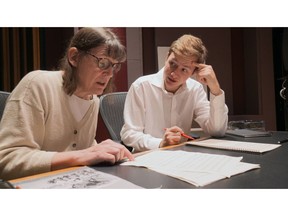 This Nov. 7, 2018, photo provided by the University of Michigan shows Professor Patricia Hall and graduate student Joshua Devries reviewing the music manuscript for "The Most Beautiful Time of Life" at the Duderstadt Center recording studio on campus in Ann Arbor, Mich. The Contemporary Directions Ensemble in October 2018 recorded the music, as it's translated from German to English. It will perform the piece Friday, Nov. 30, 2018, during a free on-campus concert. The music has not been heard since it was arranged and performed by prisoners in a World War II death camp.
