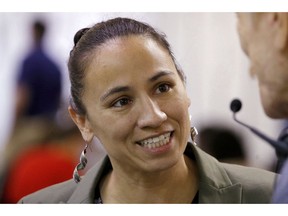 FLE - In this Oct. 1, 2018, file photo, Kansas Democratic Congressional candidate Sharice Davids talks to volunteer at her campaign office in Overland Park, Kan. Davids is challenging Republican incumbent Kevin Yoder in Kansas' 3rd District in the Nov. 6 election.