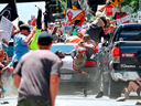People fly into the air as a car driven by James Alex Fields Jr. goes into a group of protesters demonstrating against a white nationalist rally in Charlottesville, Virginia, Aug. 12, 2017.