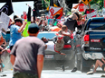 People fly into the air as a car driven by James Alex Fields Jr. goes into a group of protesters demonstrating against a white nationalist rally in Charlottesville, Virginia, Aug. 12, 2017.