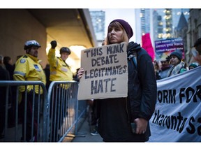 Protesters demonstrate outside a Toronto Munk debate featuring Steve Bannon and conservative commentator David Frum in Toronto on Friday, November 2, 2018.