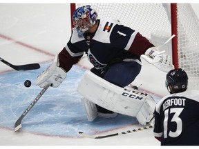 Colorado Avalanche goaltender Semyon Varlamov makes a stick save of a shot against the Nashville Predators in the first period of an NHL hockey game Wednesday, Nov. 7, 2018, in Denver.