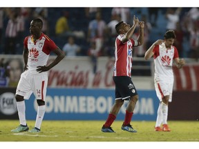 Luis Narvaez of Colombia's Junior, center, celebrates at the end of a Copa Sudamericana second leg semifinal match against Colombia's Independent Santa Fe at the Metropolitano stadium in Barranquilla, Colombia, Thursday, Nov., 29, 2018. Junior won 3-0 on aggregated and and qualified for the final.
