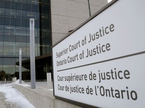 A sign noting the Quinte Courthouse is the home of the local Ontario Superior Court stands outside the building's main entrance Wednesday January 21, 2015 in Belleville, Ont.