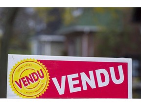 A sign meaning sold is shown on the west island of Montreal, Saturday, November 4, 2017. Home sales across Montreal and its surrounding areas in October surged 11 per cent compared with a year ago, as the city's real estate market continued on a hot streak.
