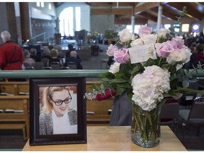 qA photograph and a floral arrangement sit in the reception area at the funeral for Rebecca Schofield at Immaculate Heart of Mary Catholic Church in Riverview, N.B., on February 21, 2018. A young New Brunswick girl who inspired people around the world to perform random acts of kindness will be honoured posthumously today with the Order of New Brunswick. Becca Schofield died in February at the age of 18 -- two years after being diagnosed with terminal brain cancer. Her movement on social media, with the hashtag #BeccaToldMeTo, quickly went viral and inspired ongoing acts of compassion and generosity.