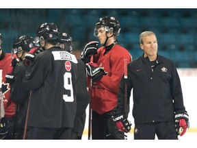 The head coach of Canada's junior national team will soon have to invite dozens of the country's most talented young hockey players to selection camp. Canada Head Coach Tim Hunter is seen during practice at the Sandman Centre in Kamloops, B.C., Monday, July, 30, 2018.