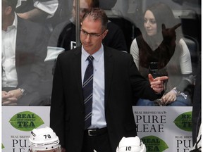 Los Angeles Kings coach John Stevens gestures to his team during the third period against the Colorado Avalanche in an NHL hockey game Thursday, March 22, 2018, in Denver. The struggling Kings fired Stevens on Sunday just 13 games into his second season in charge.