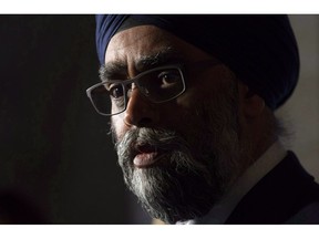 Minister of National Defence Minister Harjit Sajjan speaks with the media following a cabinet meeting on Parliament Hill in Ottawa, Wednesday October 24, 2018. Federal Conservatives rushed to defend Defence Minister Harjit Sajjan Thursday night after a Conservative riding association posted a controversial comment about him on its Facebook page.