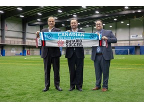 Johnny Misley, CEO of Ontario Soccer, left to right, David Clanachan, commissioner of Canadian Premier League and Dino Rossi, League1 Ontario commissioner pose in this undated handout photo. The Canadian Premier League has bought Ontario's League 1 and plans to use the feeder league to help develop talent.