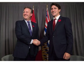 Prime Minister Justin Trudeau, right, meets with Vancouver mayor-elect Kennedy Stewart in Vancouver, on Thursday November 1, 2018. Four NDP provincial politicians from British Columbia are urging Prime Minister Justin Trudeau to immediately call a byelection in the federal riding of Burnaby-South.