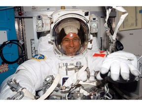 Former Canadian astronaut Dave Williams in his spacesuit getting ready for a spacewalk in a NASA handout photo. THE CANADIAN PRESS/HO-NASA, MANDATORY CREDIT