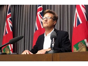 Manitoba Infrastructure Minister Ron Schuler speaks to media in Winnipeg on Thursday, July 26, 2018. The Manitoba government has signed a deal with a private firm to take over operation of the province's fleet of water bombers. Babcock Canada will provide wildfire suppression services, including water bomber aircraft, after winning a bid for the contract earlier this year.