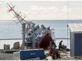 The Canadian Coast Guard patrol ship, CCGS Corporal McLaren, is shown on its side on Sunday, Nov. 18, 2018.